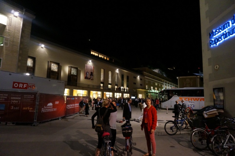 People riding bicycles back home after a performance at Mozart House.